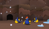 Mario standing by stranded Cooligans in Snow Rise