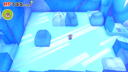 Mario standing near two boulders containing a Shiny Ice Flower each on Ice Vellumental Mountain of The Origami King.