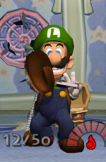 Luigi collecting Mario's Shoe in the game Luigi's Mansion.