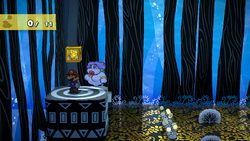 Mario next to the Shine Sprite in the airplane room of the Great Tree in the remake of the Paper Mario: The Thousand-Year Door for the Nintendo Switch.