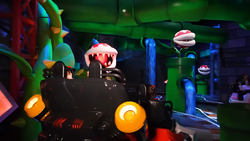 The room with Piranha Plants in Mario Kart: Bowser's Challenge, from Super Nintendo World. AR graphics are not depicted in this photo