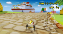 Princess Peach races at Peach Beach, in Mario Kart Wii.