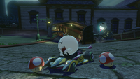 King Boo drives through Twisted Mansion in Mario Kart 8 Deluxe.