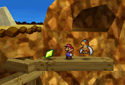 Mario finding a Star Piece on a wooden platform on Mt. Rugged in Paper Mario