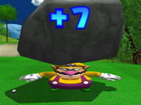 Wario getting squashed by a huge boulder after getting a +7 in Mario Golf: Toadstool Tour