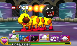 Screenshot of Wiggler & Flame Chomp as the alternative boss of World 1-Castle, from Puzzle & Dragons: Super Mario Bros. Edition.