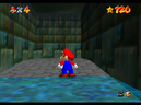 Mario in front of the wall of Shifting Sand Land