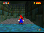 Mario in front of the wall of Shifting Sand Land