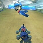 A Mii in the Dolphin Mii Racing Suit performing a Jump Boost.