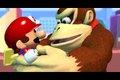Donkey Kong holds the Mini-Mario