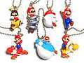 A set of keychains featuring Bee Mario, Spring Mario, Boo Mario, Mario jumping, Mario with Dash Yoshi, Blimp Yoshi, and Bulb Yoshi based on Super Mario Galaxy 2. Manufactured by Takara Tomy