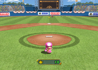Wario collects baseballs in Swing Kings from Mario Party 8.