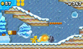 Gold Mario throwing golden fireballs in a snowy level.