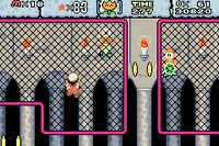 Fire Mario encountering a Climbing Koopa in #1 Iggy's Castle in Super Mario World: Super Mario Advance 2.