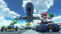 Mario, Yoshi, and other racers drive on the runway of Sunshine Airport in Mario Kart 8.