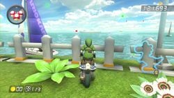 Link sees the Daisy Cruiser out in the distance while exploring the Yoshi Circuit.