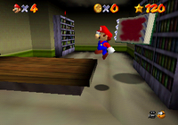 Mario jumping away from a Bookend.