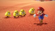 Mini Goombas chasing Mario.