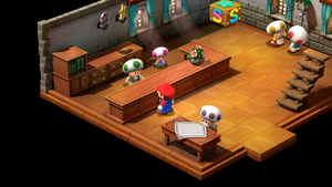 Marrymore hotel receptionist giving Mario a gift for staying in the hotel in Marrymore of Super Mario RPG.
