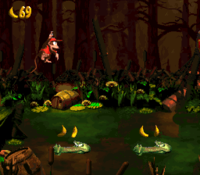 Diddy Kong jumping to some Krockheads in Krockhead Klamber from Donkey Kong Country 2: Diddy's Kong Quest