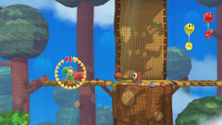 Screenshot of Bounceabout Woods from Yoshi's Woolly World