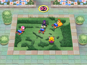 Daisy, Toadette, Wario, and Waluigi compete in Mowtown.