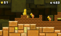 A screenshot with Gold Mario in World 2-1.
