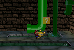 Image of Mario revealing a hidden ? Block in Toad Town Tunnels, in Paper Mario.