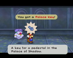 Screenshot of Mario obtaining a Palace Key in the Palace of Shadow's Riddle Tower.