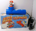 A blue Super Mario Bros. 2 Warp Pipe telephone, made by Bondwell in 1990. There were also red[2] and green variations.[3]