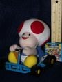 A plushie of Toad from Super Mario Kart