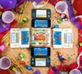 Promotional photograph showing a multiplayer session of Mario Party: The Top 100 with four New Nintendo 2DS XL systems connected via Download Play