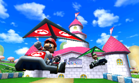 Mario and Luigi glide behind Peach's Castle in Mario Circuit.