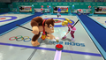 Peach and Donkey Kong competing in curling.
