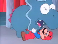 A Dino-Rhino pinning Mario to the ground in the Super Mario World episode "Send in the Clown."