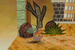 Lady Bow using Outta Sight on Mario in a battle in Gusty Gulch.