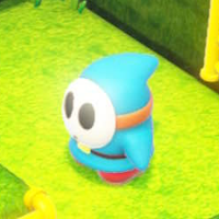 A light-blue Shy Guy from Captain Toad: Treasure Tracker.