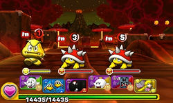 Screenshot of a Gold Goomba sighting in World 7-8, from Puzzle & Dragons: Super Mario Bros. Edition.