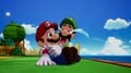 Luigi cries and hugs Mario.