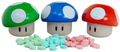 Promotional candy that came out after the release of New Super Mario Bros. The product is sold in a variety of sour candies that come packaged in Mushroom-shaped tins. They come in three fruit flavors: cherry, apple, and blue raspberry. They made cameos in Thieves, Inc., along with other Super Mario candy.