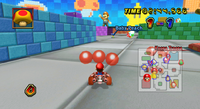 Mario competes in a Balloon Battle at Block Plaza, in Mario Kart Wii.