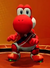 Image of Yoshi in a red uniform, from Mario Strikers: Battle League