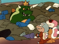 Bully and Big Mouth look at King Koopa in garbage.