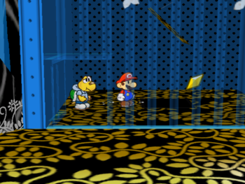 Mario getting the Star Piece  under a hidden panel in the middle of the blue cell in the Great Tree.