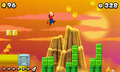 Mario, jumping on Snake Blocks in world resembling Pipe Land.