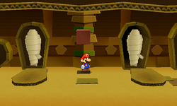 Mario near two opened coffins containing a Heart and a Jump Sticker in Sandshifter Ruins of Paper Mario: Sticker Star.