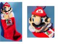 A Christmas stocking with a fuzzy Mario