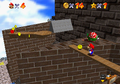 Mario climbs the Whomp's Fortress