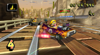 Pre-release photo of Wario driving through Wario's Gold Mine in Mario Kart Wii.