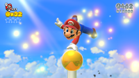 Mario grabbing the top of a Goal Pole